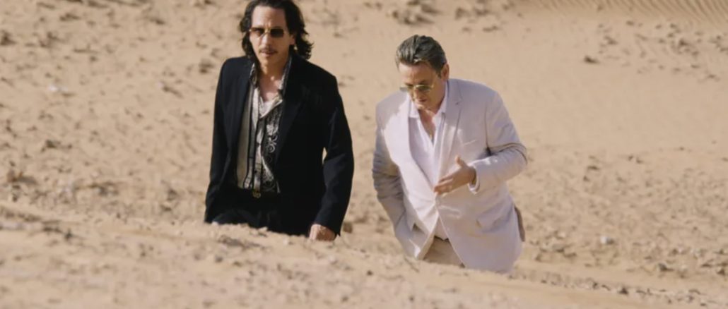 2 men walking in the desert