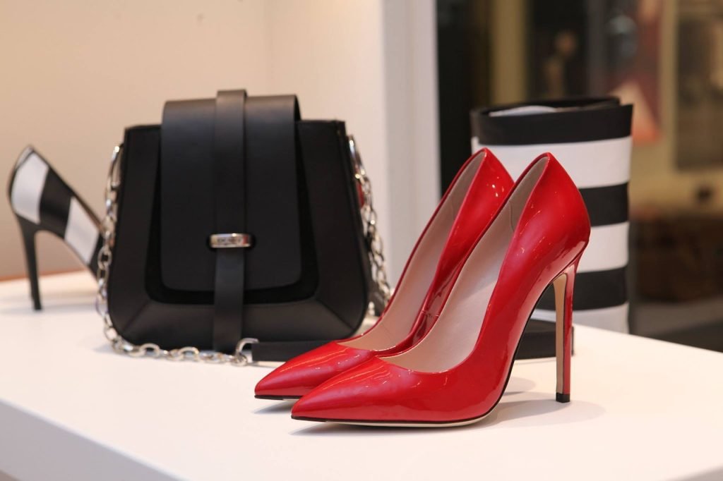 red high heels shoes with black handbag