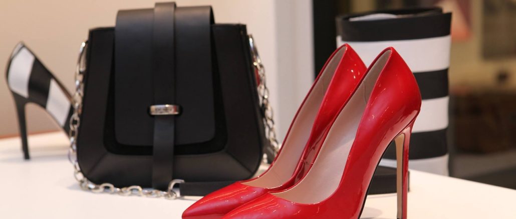 red high heels shoes with black handbag