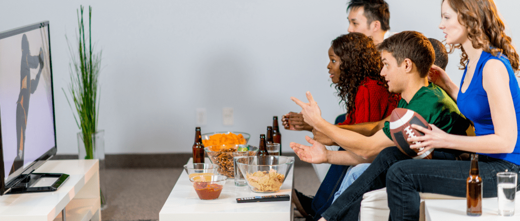 family watching the superbowl on tv