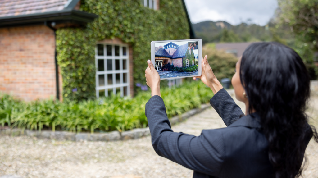 woman taking a picture of a real estate property