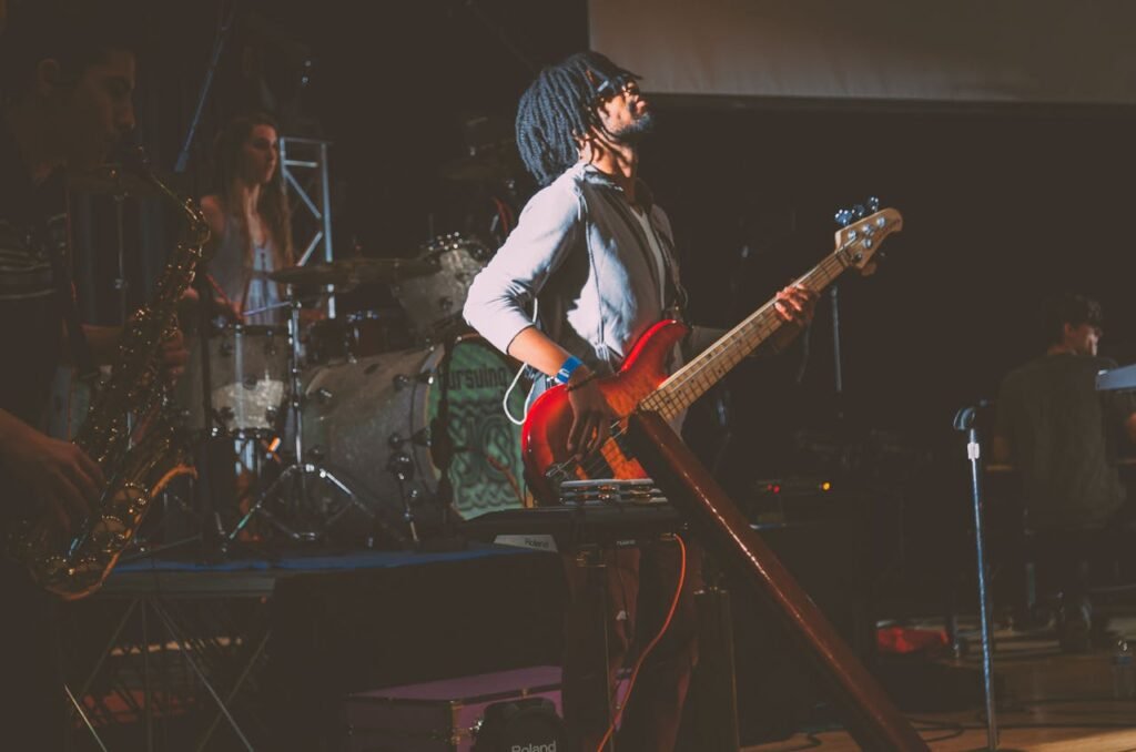 man-standing-while-playing-guitar