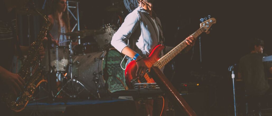 man-standing-while-playing-guitar