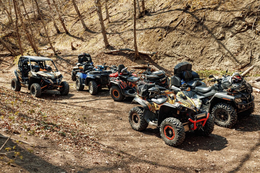 Group of Quad ATV cars all terrain vehicle parked on mountain road