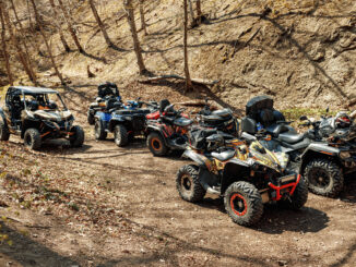 Group of Quad ATV cars all terrain vehicle parked on mountain road