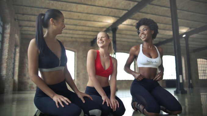 three-women-kneeling-on-floor-