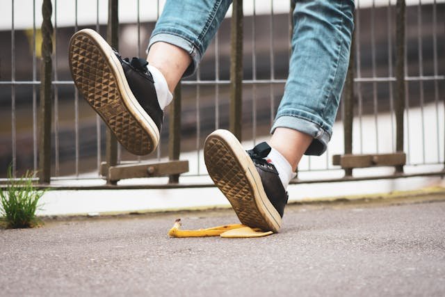 a person's feet stepping on a banana peel