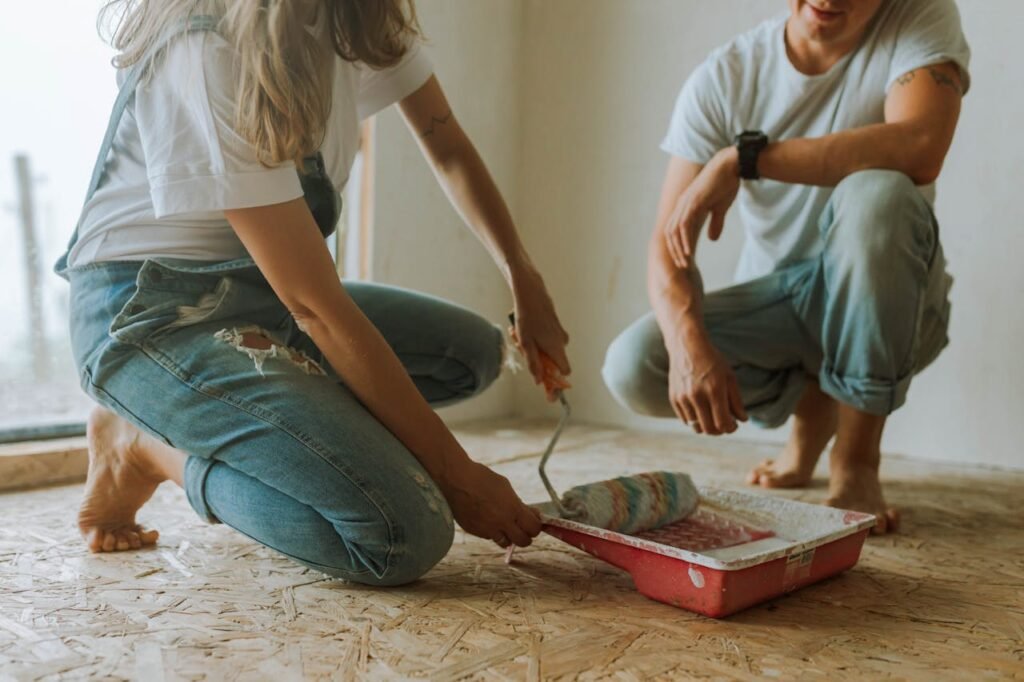 man and woman doing home painting