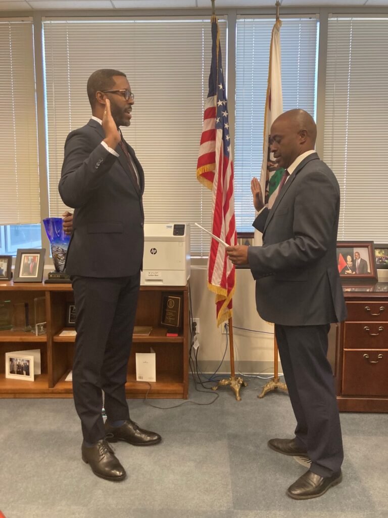 •	Dominick Robinson is sworn into office, taking the oath of service in a formal ceremony, by the state superintendent of public instruction 