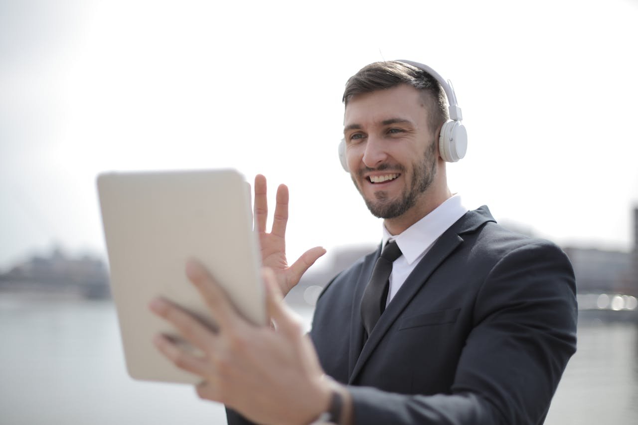 man-in-black-suit-jacket-wearing-white-headphones